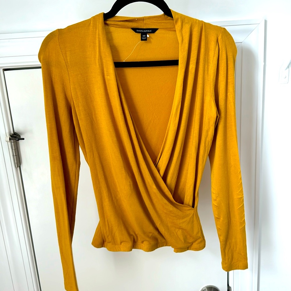 Banana Republic yellow blouse. Wrap shape to fit your curves.